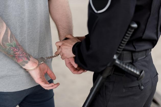 cropped-shot-of-policewoman-with-truncheon-handcuf-2021-09-03-14-08-29-utc