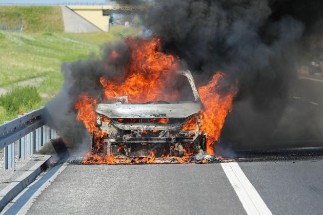 Car-burning-on-highway-smaller