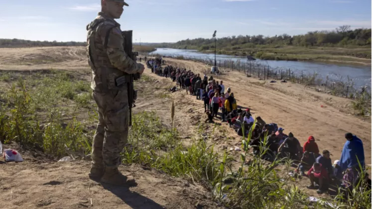 migranți