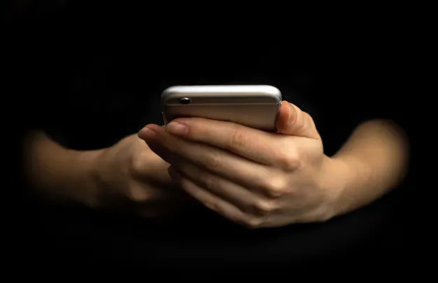 person-uses-mobile-phone-front-view-black-background-hands-smartphone-close-up-high-tech-technology-communication-concept-photo_526934-3494
