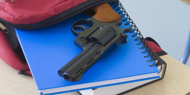 backpack-notebooks-and-handgun