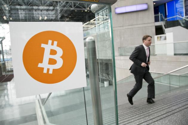 FILE - In this April 7, 2014 file photo, a man arrives for the Inside Bitcoins conference and trade show in New York. An Australian man long thought to be associated with the digital currency Bitcoin has publicly identified himself as its creator. BBC New