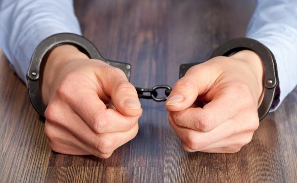 depositphotos_18573119-stock-photo-hands-in-handcuffs