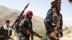 armed-men-who-are-against-taliban-uprising-walk-at-their-check-post-at-the-ghorband-district