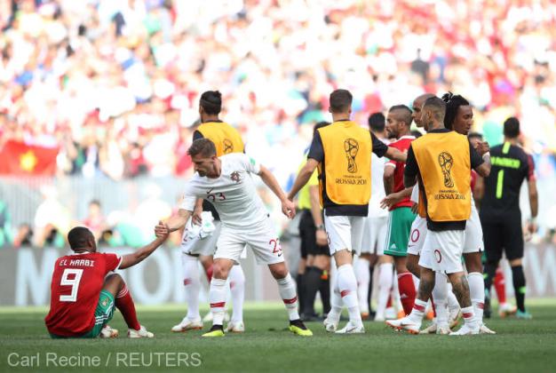 Soccer Football - World Cup - Group B - Portugal vs Morocco - Luzhniki Stadium, Moscow, Russia - June 20, 2018 Portugal's Adrien Silva helps up Morocco's Ayoub El Kaabi after the match REUTERS/Carl Recine
