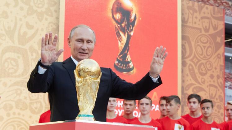FIFA President Gianni Infantino and President of Russian Federation Vladimir Putin stay on the stage with a Trophy during FIFA World Cup Trophy Tour at Luzhniki stadium on September 9, 2017 in Moscow, Russia. (Oleg Nikishin/FIFA/Getty Images)