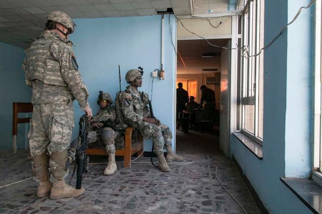 BAGHDAD, IRAQ - NOVEMBER 2007: US Army QRF inside their base before going out on patrol in Baghdad.