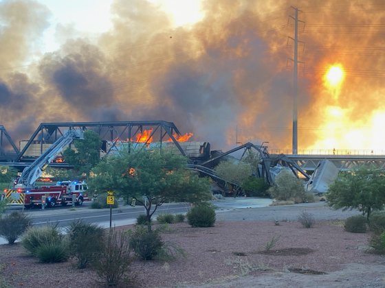July 29, 2020, Tempe, Arizona, United States: Eyewitness Sylvia Moir said: ''Avoid the Rio Salado Ash Curve in Tempe Arizona after train derailment with fire and bridge collapse.'',Image: 548074605, License: Rights-managed, Restrictions: * United Kingdom