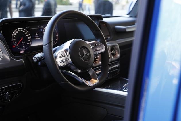 A steering wheel sits on the dashboard of a Mercedes-Benz G-Class off-roader on display outside the Daimler AG exhibition hall on day two of the IAA Frankfurt Motor Show in Frankfurt, Germany, on Wednesday, Sept. 11, 2019. The 68th IAA show runs from Sep
