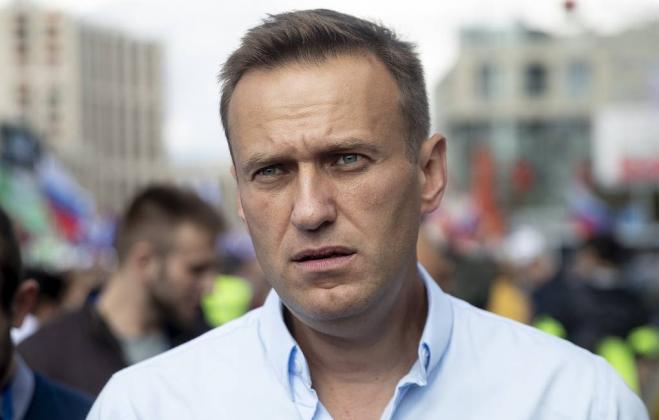 FILE In this file photo taken on Saturday, July 20, 2019, Russian opposition activist Alexei Navalny attends a protest in Moscow, Russia. Navalny has been detained by police near his home in Moscow as he left for a jog, it was reported on Wednesday, July