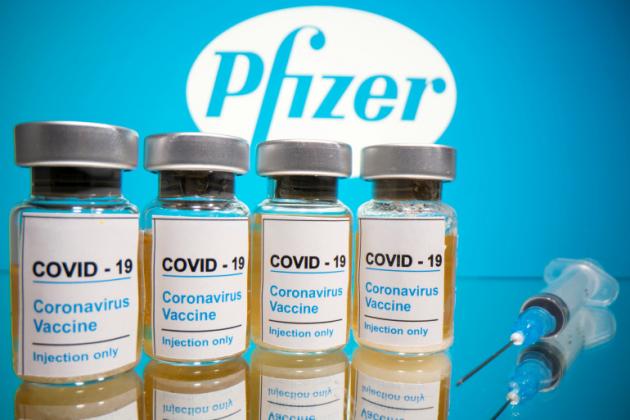 FILE PHOTO: Vials with a sticker reading, "COVID-19 