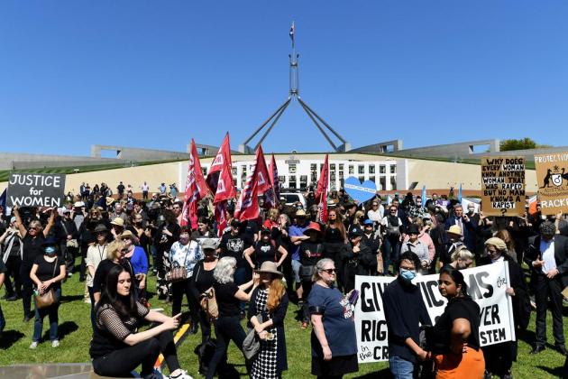 Protesters attend a rally against sexual violence and gender inequality in front of Parliament House in Australia's capital city Canberra on March 15, 2021. (Photo by Saeed KHAN / AFP)