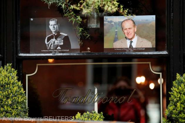 Photos depict Britain's Prince Philip, husband of Queen Elizabeth, who died at the age of 99, outside a pub in Windsor, near London, Britain, April 10, 2021. REUTERS/Andrew Boyers