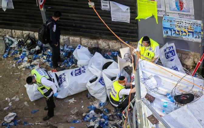 Israeli rescue forces and police at the scene after a mass fatality scene during the celebrations of the Jewish holiday of Lag Baomer on Mt. Meron, in northern Israel on April 30, 2021. Photo by David Cohen/Flash90 *** Local Caption *** ל"ג בעומר
לג בעומר