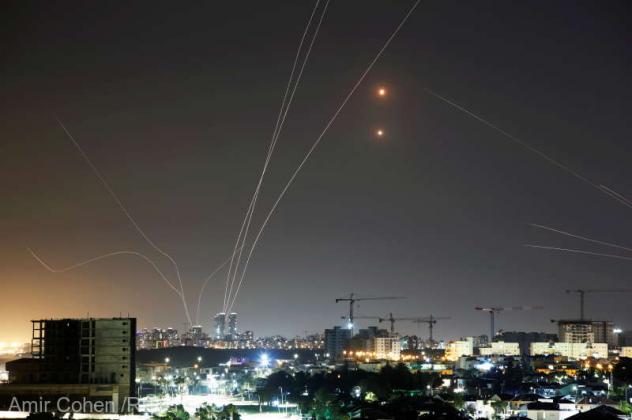 Streaks of light are seen as Israel's Iron Dome anti-missile system intercepts rockets launched from the Gaza Strip towards Israel, as seen from Ashkelon, Israel May 11, 2021. REUTERS/Amir Cohen REFILE - CORRECTING INFORMATION