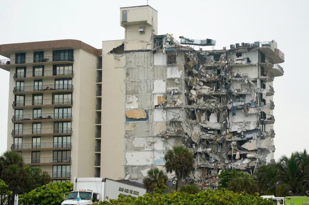 A view of a building is shown after a partial collapse, Thursday, June 24, 2021, in Surfside, Fla. A wing of a 12-story beachfront condo building collapsed with a roar in a town outside Miami early Thursday, trapping residents in rubble and twisted metal.