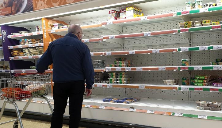 A shopper looks at nearly empty shelves of pre-cooked meat products in Sainsbury's, north London just after 9am. The Government and retailers warn that food and fuel shortages could continue until Christmas due to labour shortages following Brexit.
Short